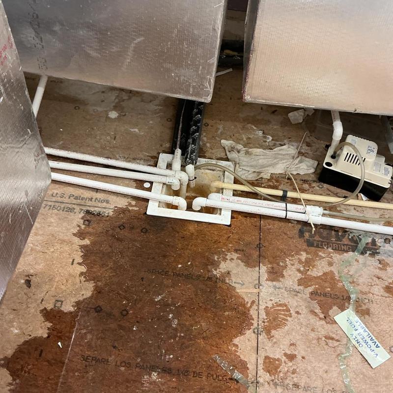 Floor sink and PVC piping with condensation drain lines Floor sink and PVC piping with condensation drain lines