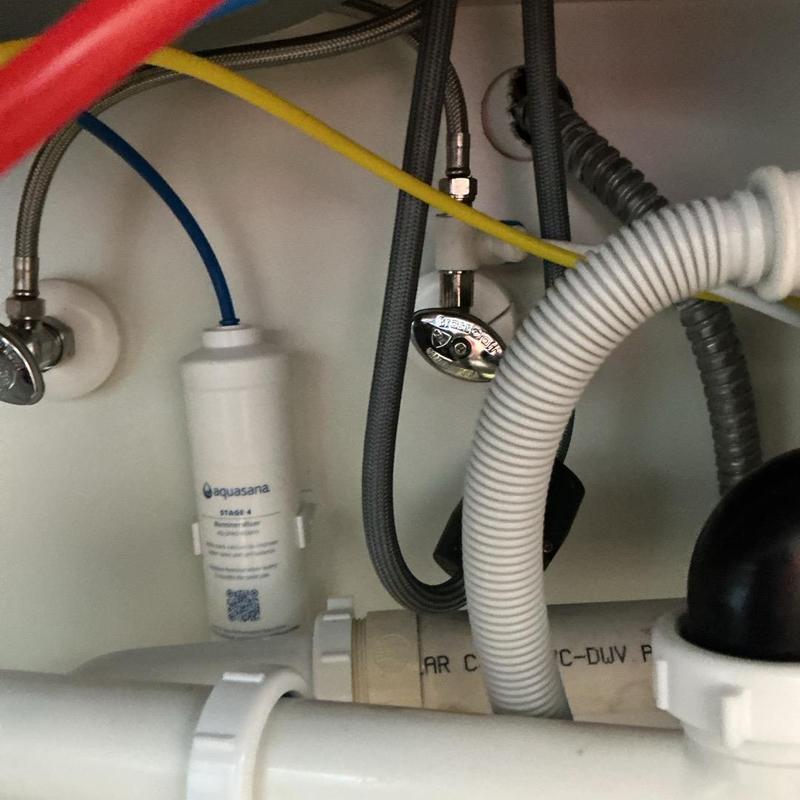 Reverse osmosis filter installed under sink plumbing Reverse osmosis filter installed under sink plumbing