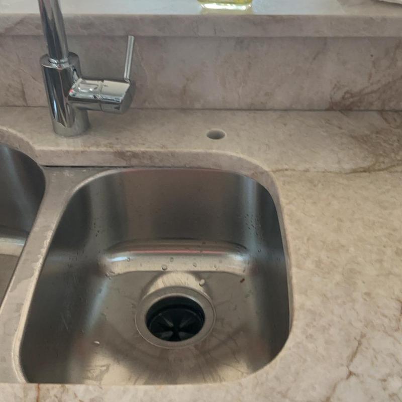 Kitchen sink faucet with new installation hole next to it Kitchen sink faucet with new installation hole next to it