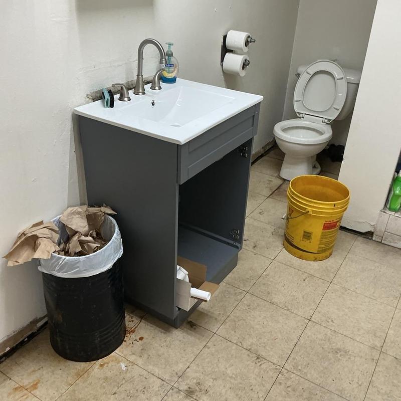 Bathroom sink P-trap installation with open vanity cabinet Bathroom sink P-trap installation with open vanity cabinet