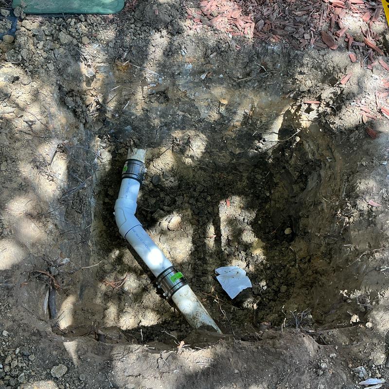3-inch PVC sewer pipe with 45-degree fitting and clamps