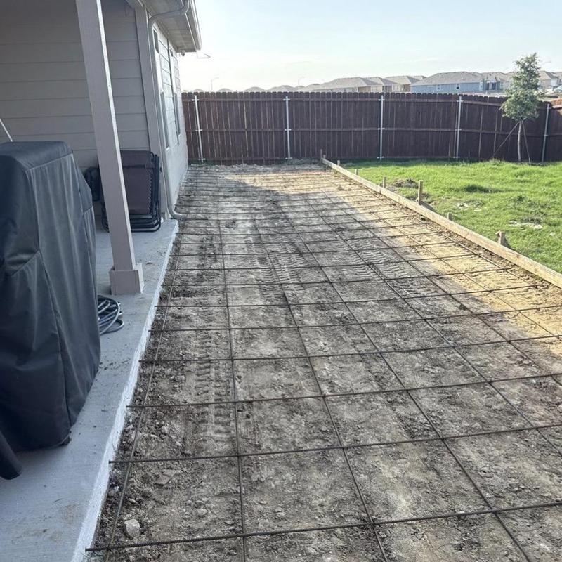Concrete patio wire mesh installation on soil base