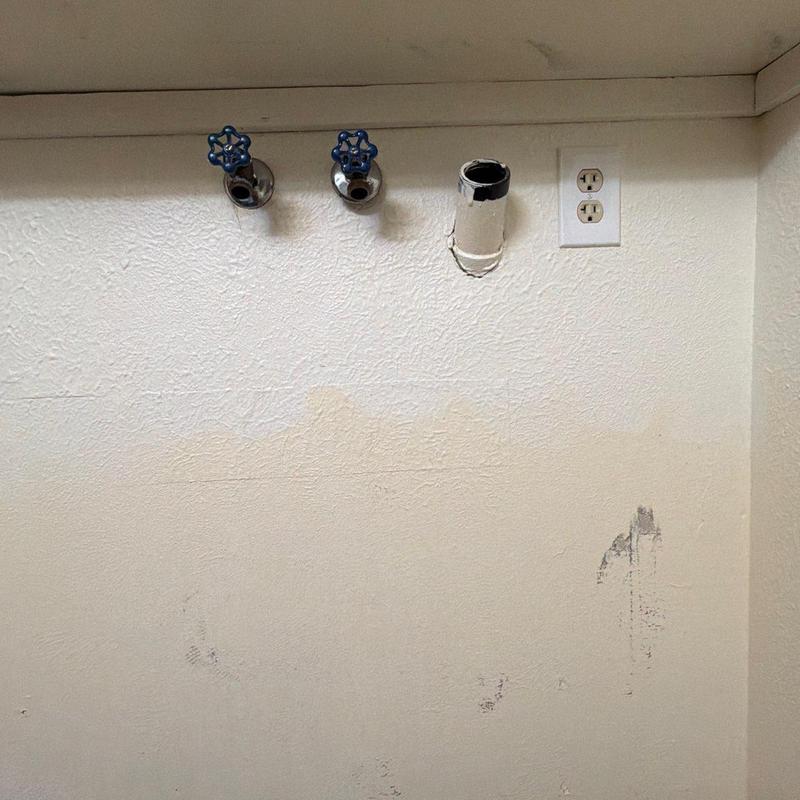 P-Trap and water valve plumbing setup on wall P-Trap and water valve plumbing setup on wall