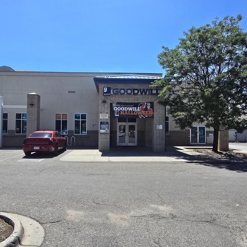 Exterior facade of Goodwill store with parking lot