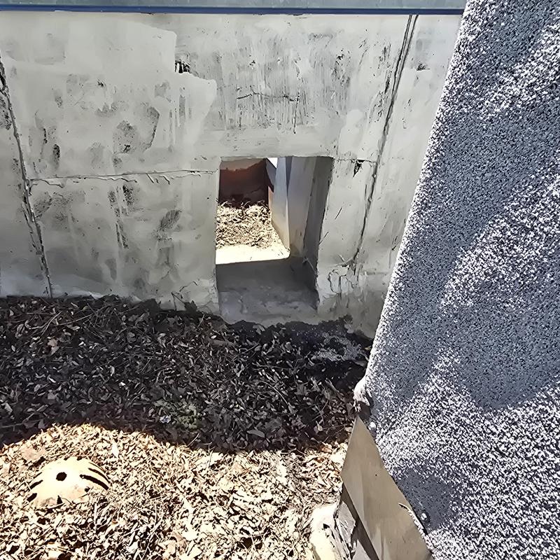 Flat roof scupper drain cleared of debris in Aurora