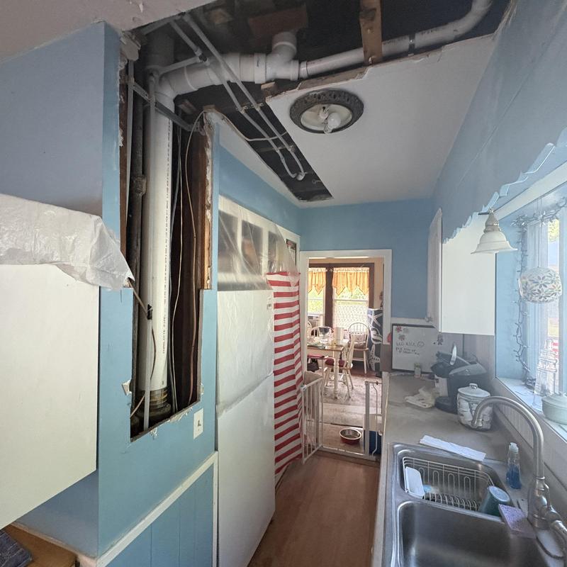 PVC drain and PEX water piping installation in kitchen wall PVC drain and PEX water piping installation in kitchen wall