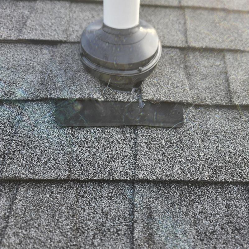Plumbing vent collar on asphalt shingle roof repair
