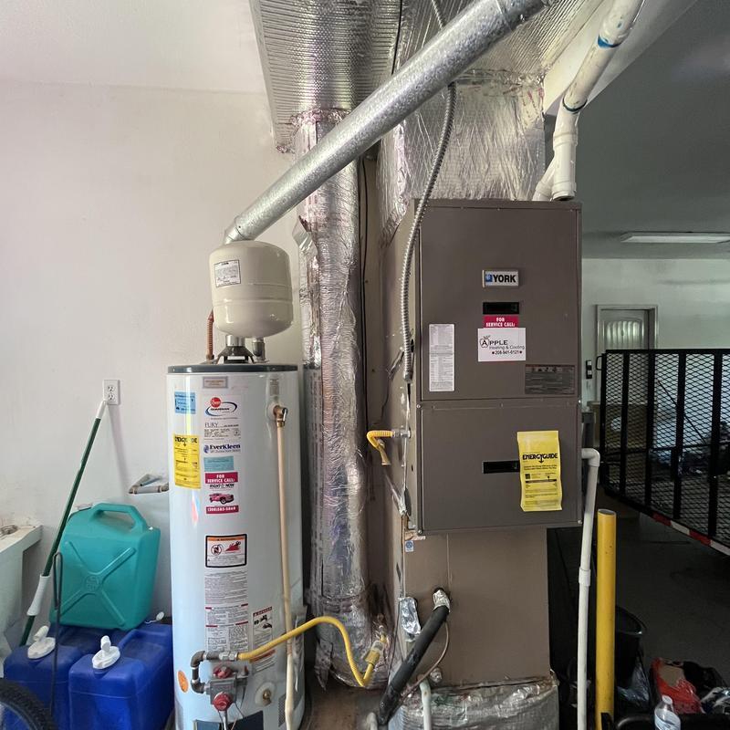 Water heater and HVAC system with ductwork and piping Water heater and HVAC system with ductwork and piping