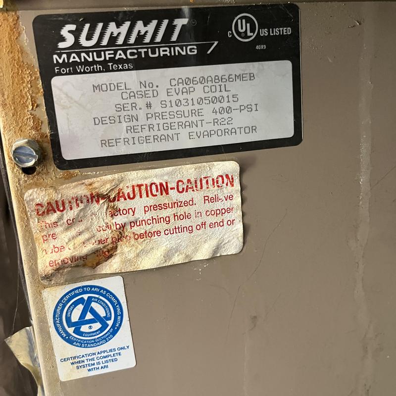 Cased evaporator coil label on HVAC unit Cased evaporator coil label on HVAC unit