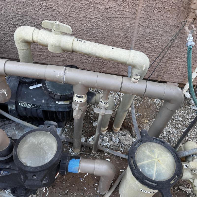 PVC pool piping and valves near pump system PVC pool piping and valves near pump system