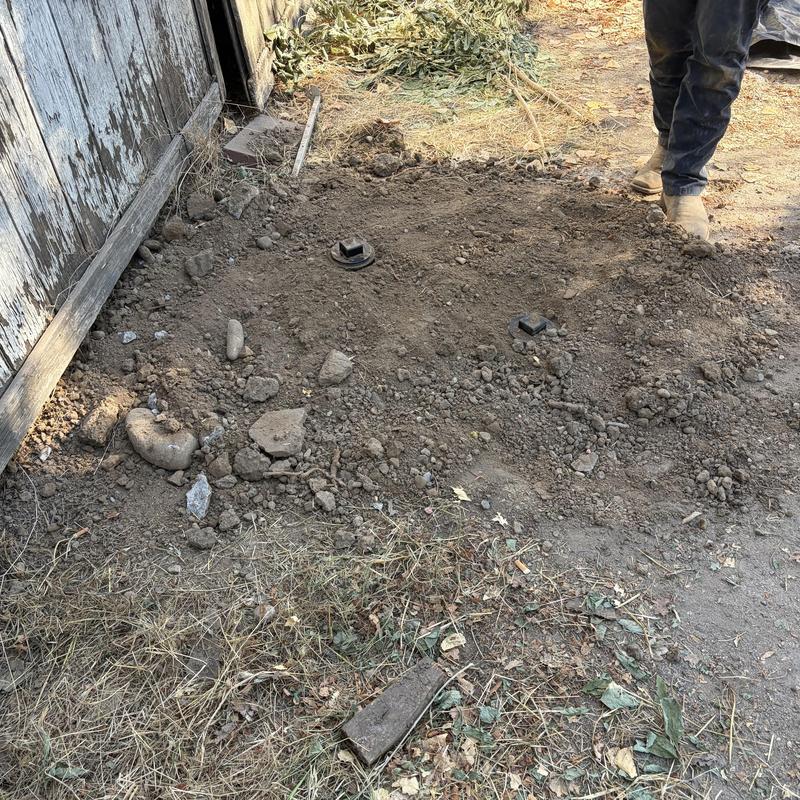 Main sewer cleanout installation in dirt yard Main sewer cleanout installation in dirt yard