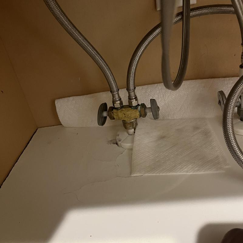 Dual stop valve under kitchen sink with hoses Dual stop valve under kitchen sink with hoses