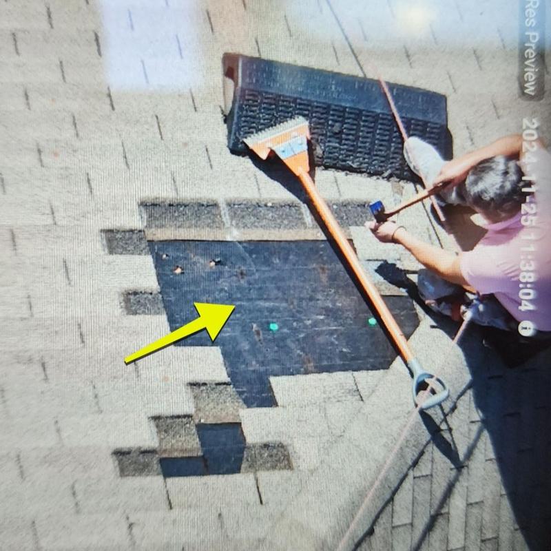 Asphalt roof shingles removal and repair in progress Asphalt roof shingles removal and repair in progress