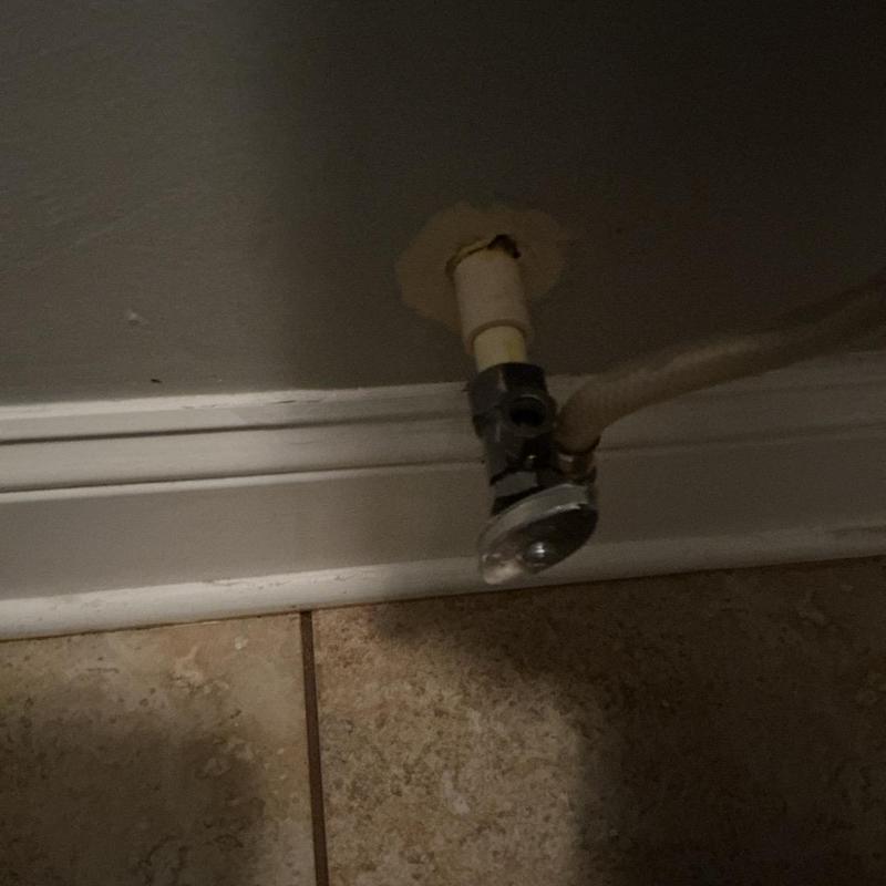 Toilet shut-off valve with supply line near baseboard Toilet shut-off valve with supply line near baseboard
