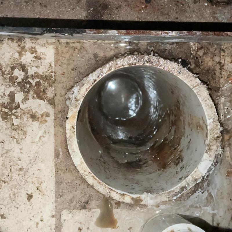 Floor drain pipe after clog removal, draining properly Floor drain pipe after clog removal, draining properly