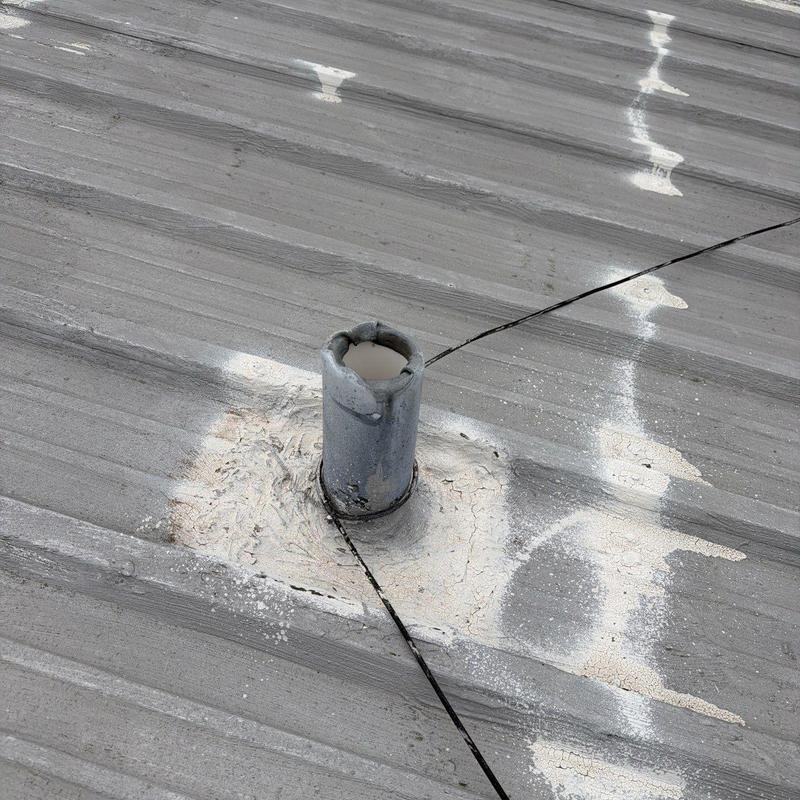 Metal roof flashing with hail damage and sealing wear