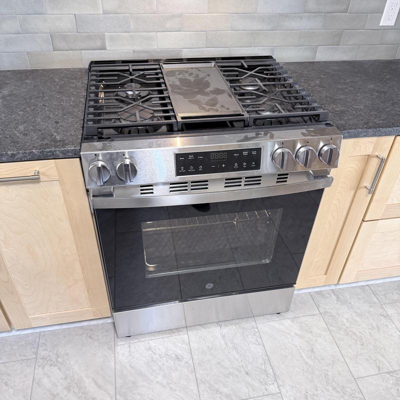 Gas range stove installation in kitchen cabinetry Gas range stove installation in kitchen cabinetry