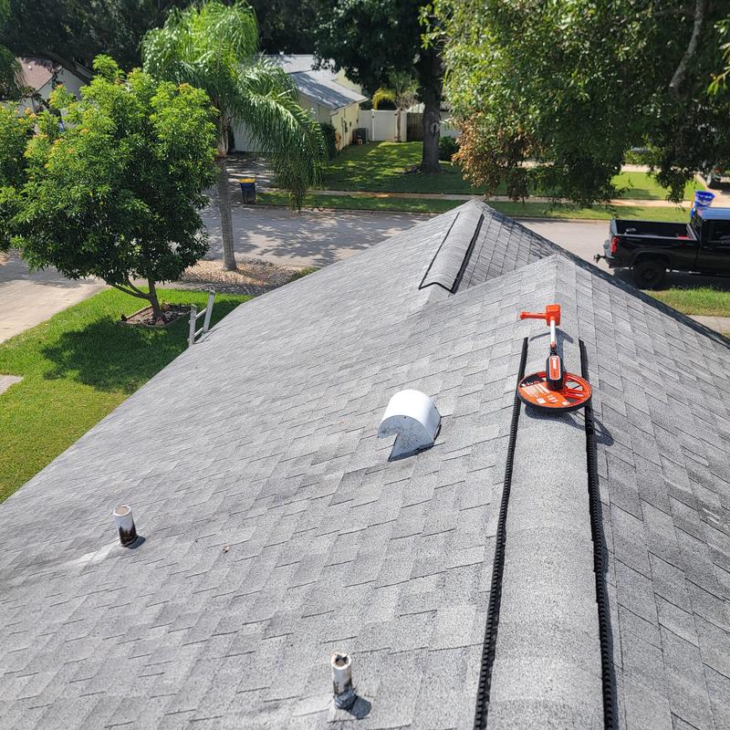 Roof shingles hail damage inspection with measuring wheel Roof shingles hail damage inspection with measuring wheel