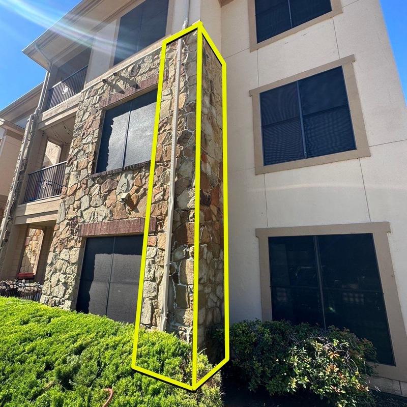 Stone exterior wall corner with repair marking
