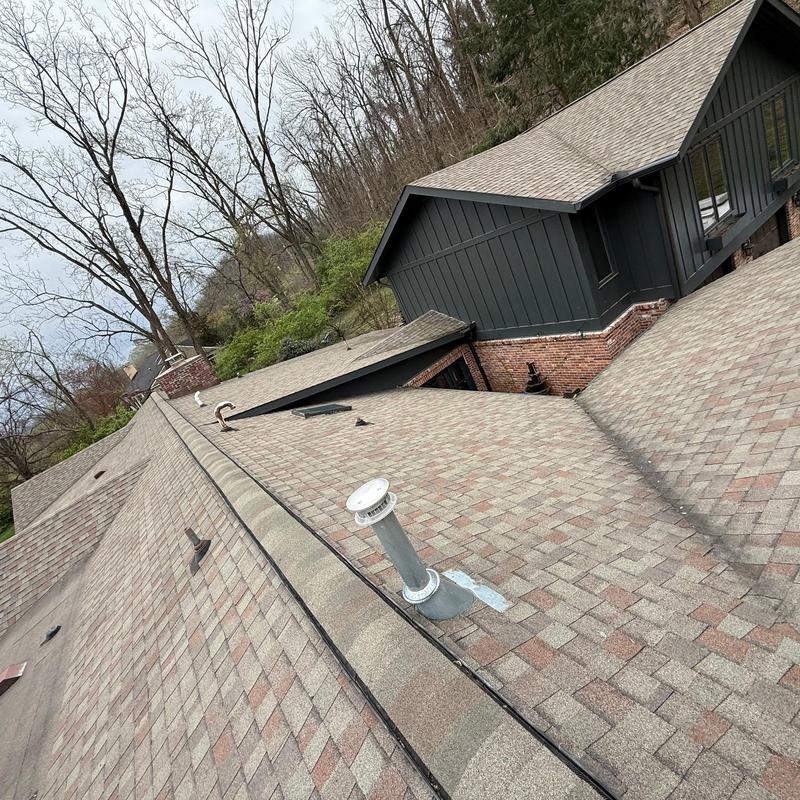 Asphalt shingle roof with vent pipe and flashing details