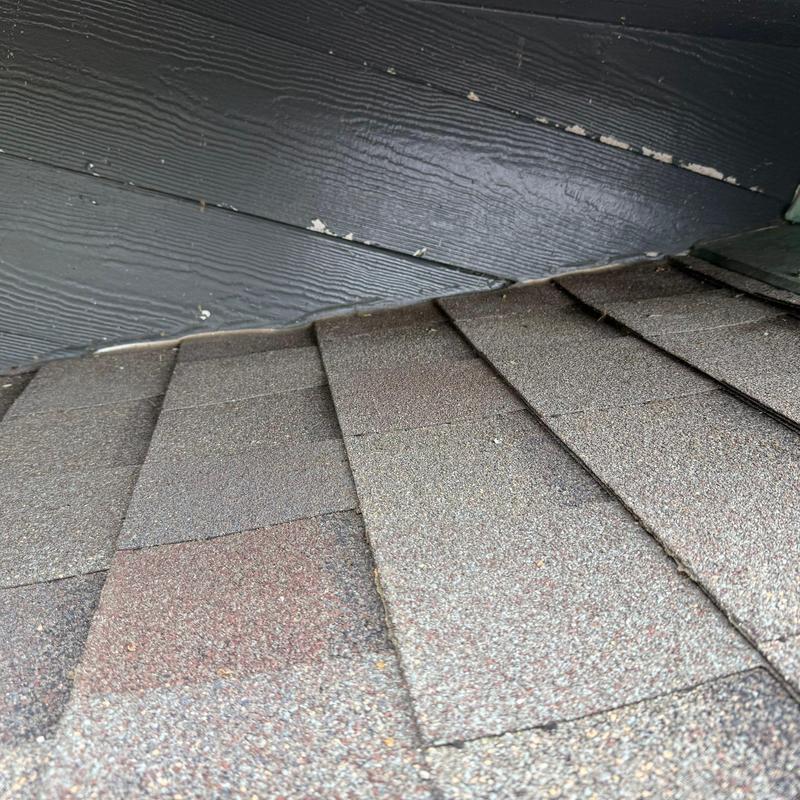 Asphalt roofing shingles with hail damage and wear
