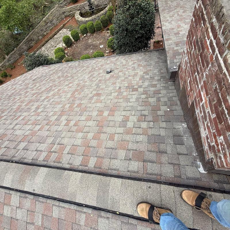 Asphalt shingle roof with hail damage inspection