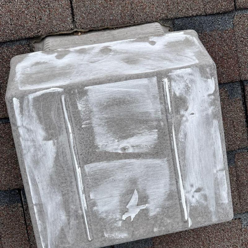 Roof vent with visible hail damage and wear