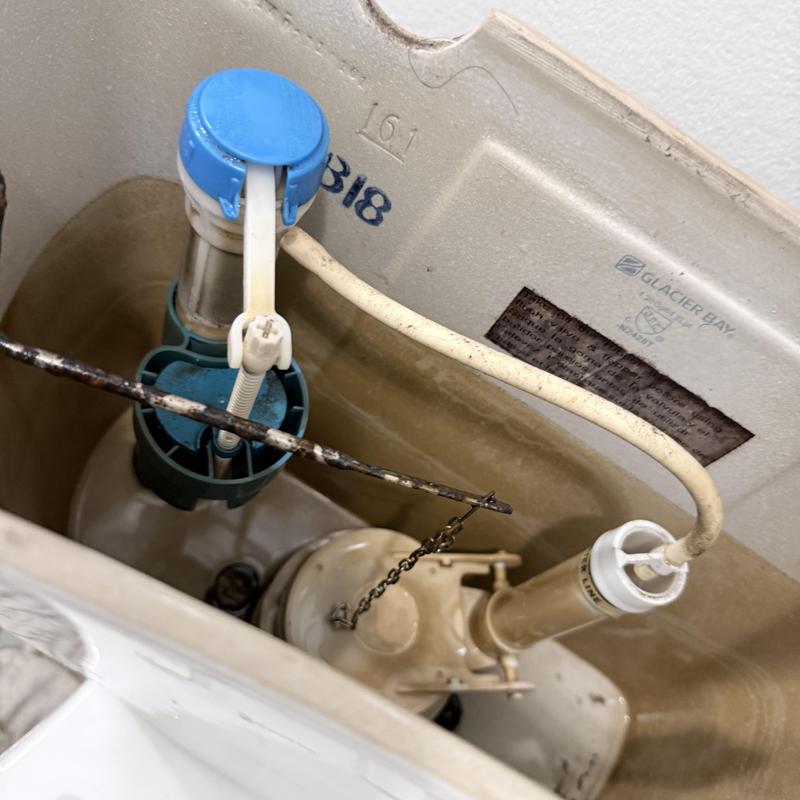 Toilet fill valve and flapper inside tank Toilet fill valve and flapper inside tank