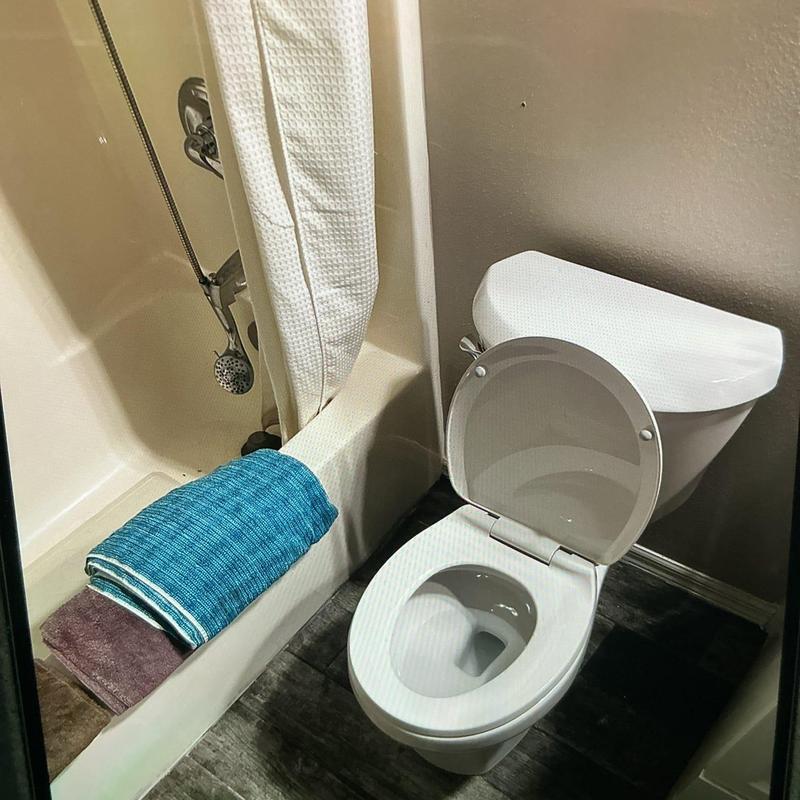 American Standard toilet installation in bathroom corner