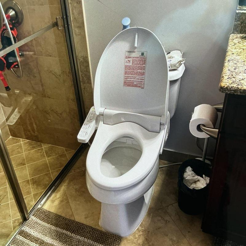 Toto toilet with bidet seat installed in bathroom
