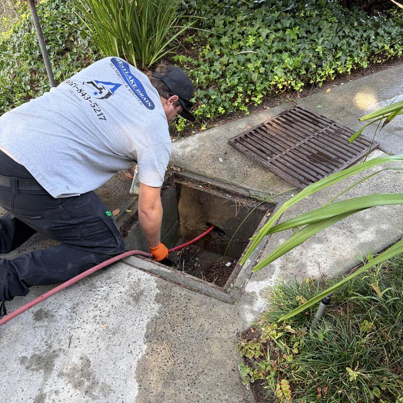 Storm drain hydro jet cleaning with technician