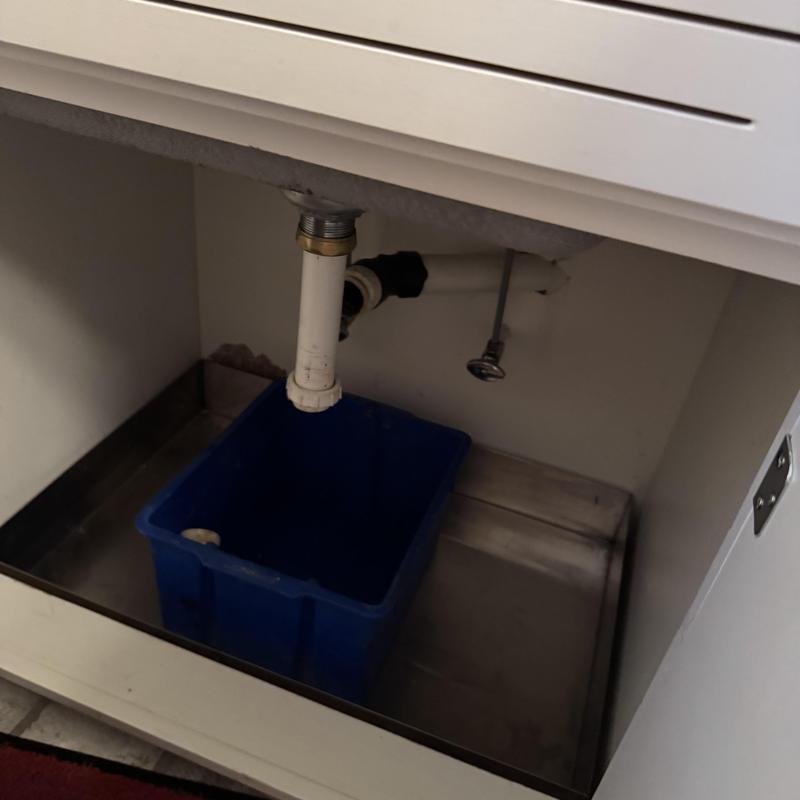 Laundry sink drain pipe with blue catch basin Laundry sink drain pipe with blue catch basin