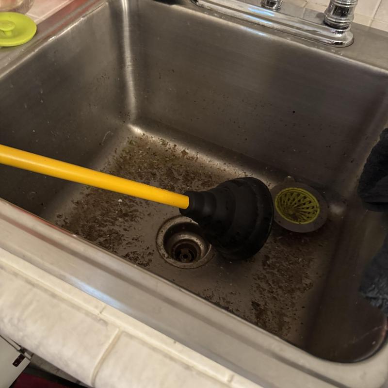 Laundry sink drain with plunger clearing blockage Laundry sink drain with plunger clearing blockage