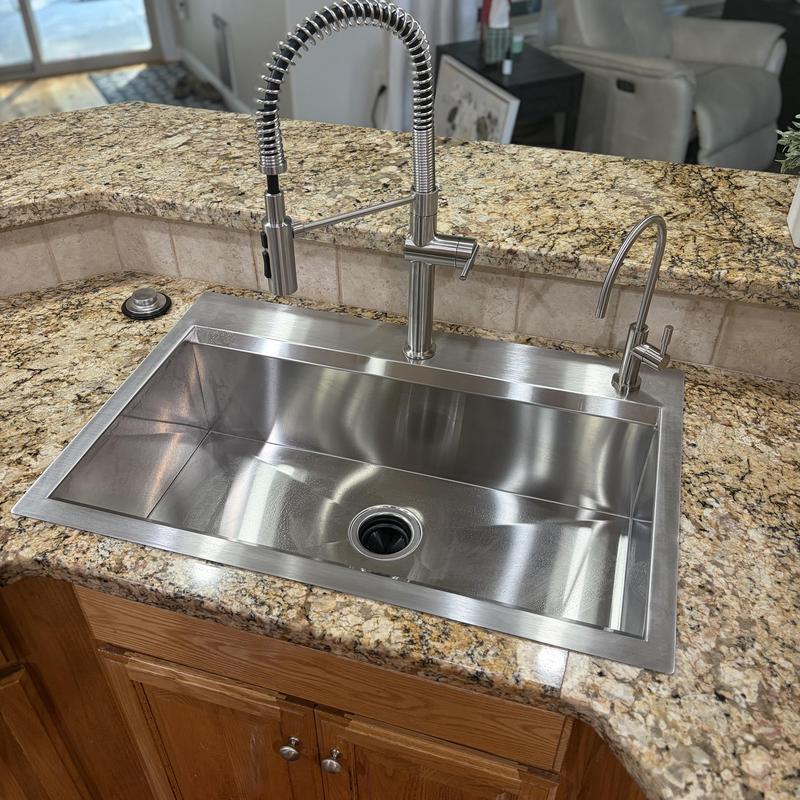 Stainless steel kitchen sink and faucet installation Stainless steel kitchen sink and faucet installation