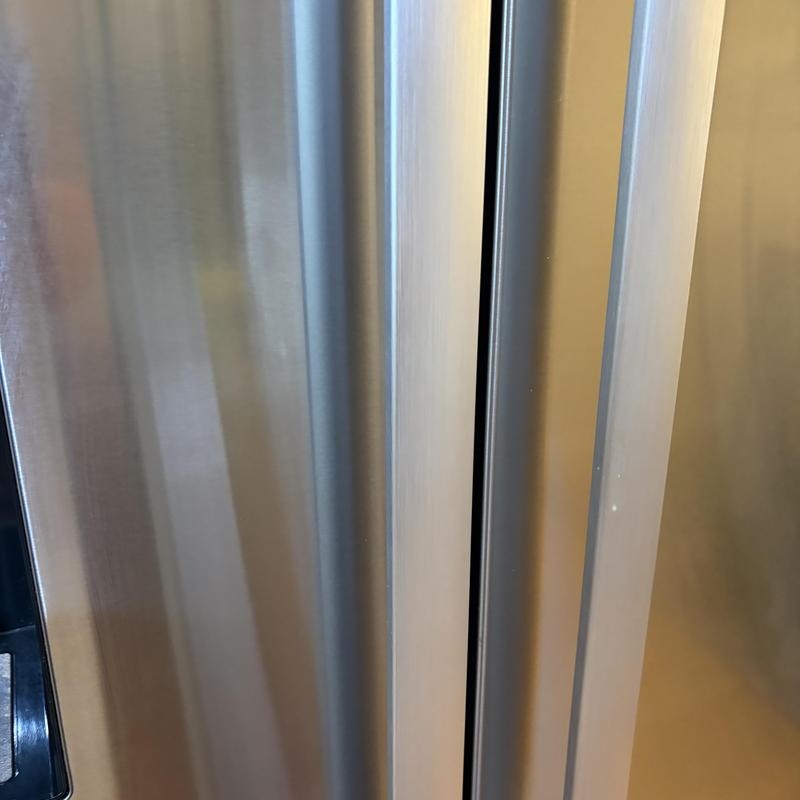 Bosch refrigerator door handle replacement close-up Bosch refrigerator door handle replacement close-up