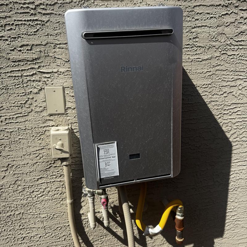 Rinnai tankless water heater exterior unit on wall