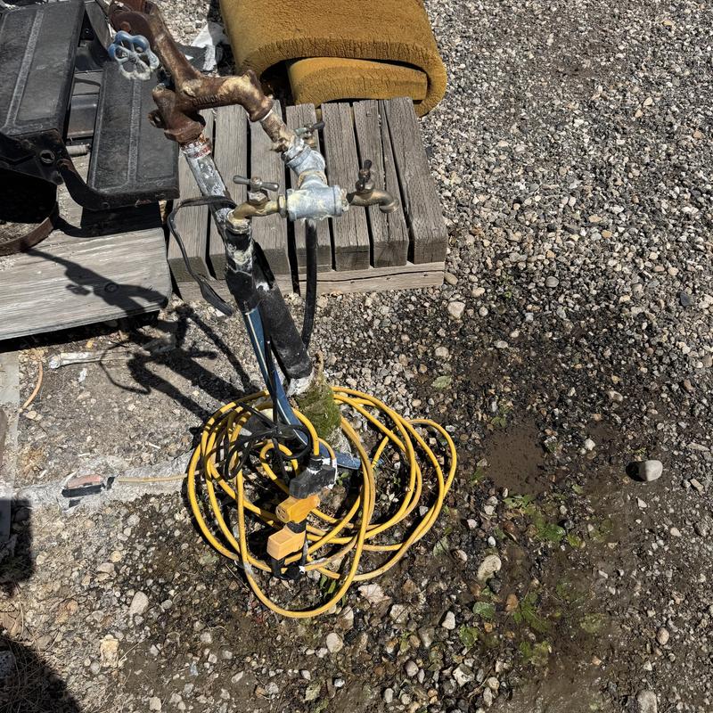 Yard hydrant with leaking riser and electrical cords Yard hydrant with leaking riser and electrical cords