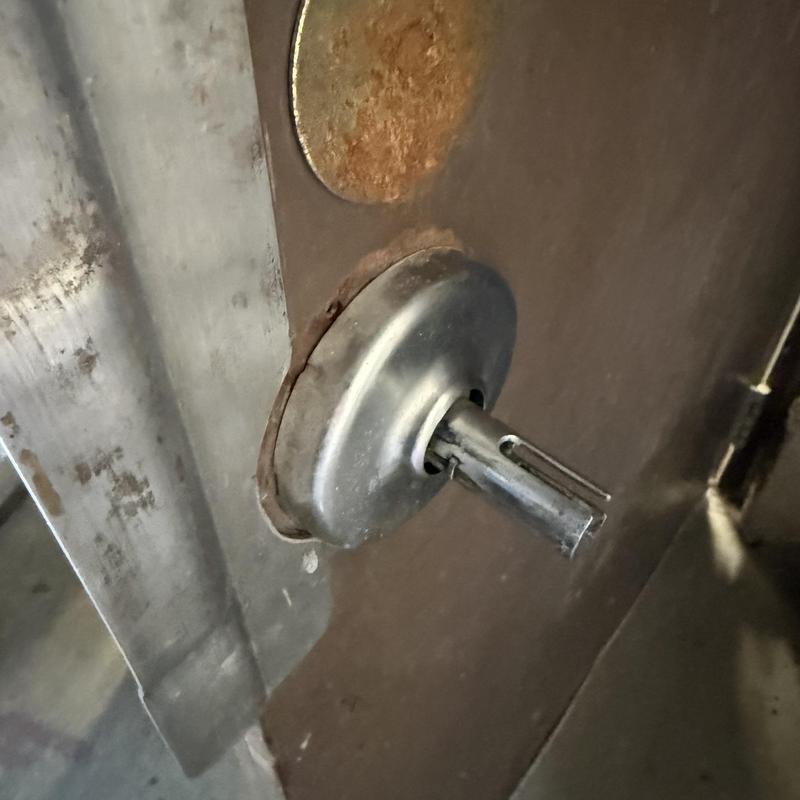 Lever handle assembly on metal door at Tulsa school Lever handle assembly on metal door at Tulsa school