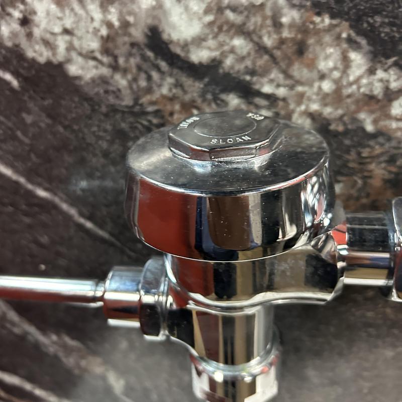 Flush valve valve stem on commercial toilet system Flush valve valve stem on commercial toilet system