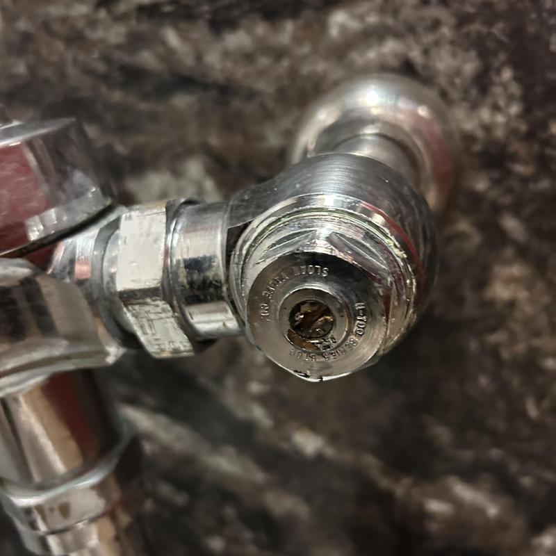Angle stop valve with water hammer arrestor in commercial property Angle stop valve with water hammer arrestor in commercial property