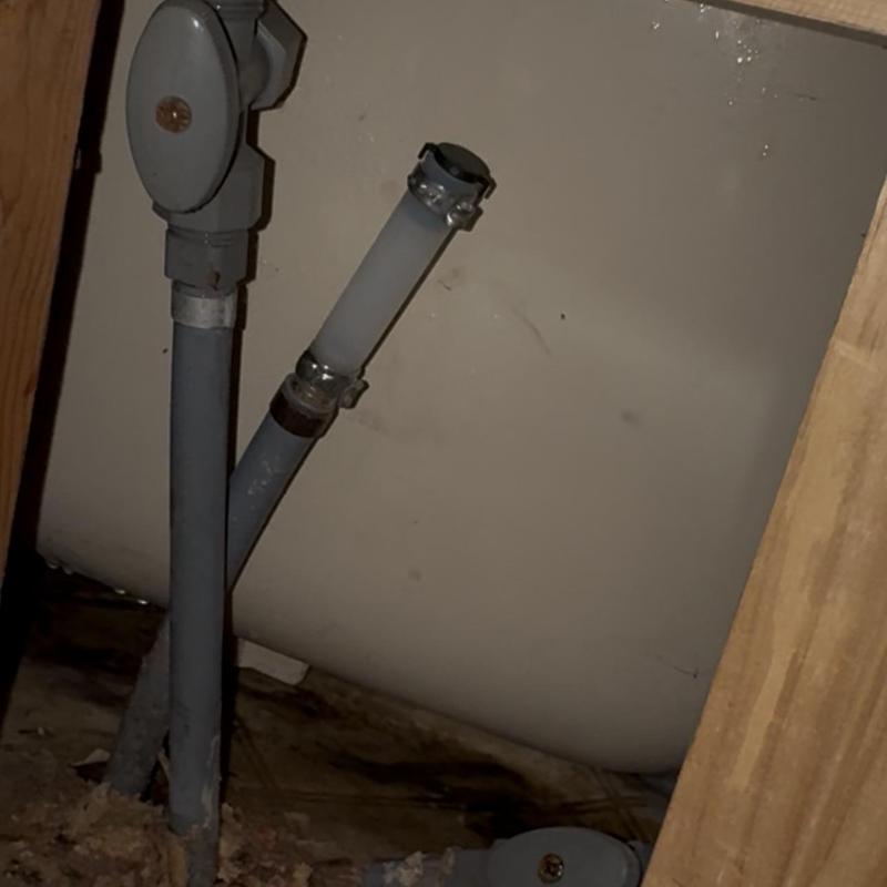 Polybutylene pipe capped behind bathroom wall Polybutylene pipe capped behind bathroom wall