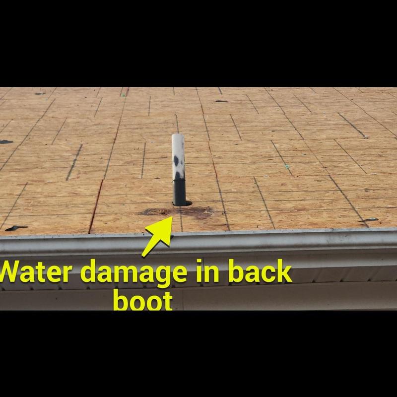 Plumbing vent pipe boot with water damage on roof decking Plumbing vent pipe boot with water damage on roof decking