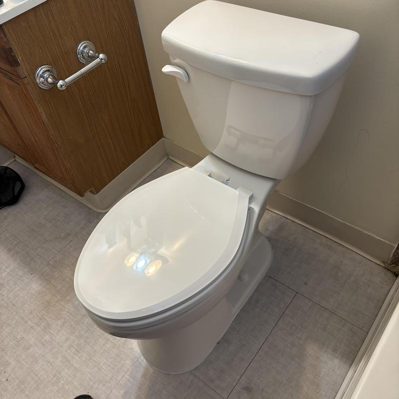 Toilet installation with wax ring and caulking