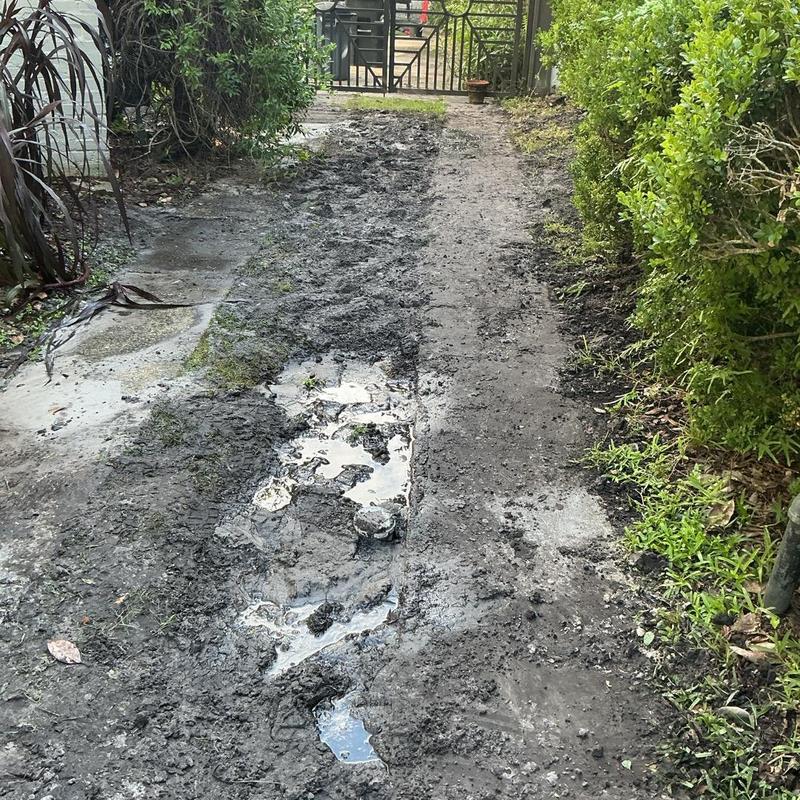 Clay sewer line trench with exposed muddy ground Clay sewer line trench with exposed muddy ground