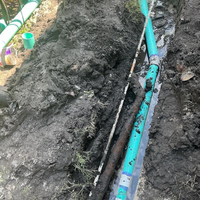 Clay sewer pipe replacement with new PVC pipe in trench Clay sewer pipe replacement with new PVC pipe in trench