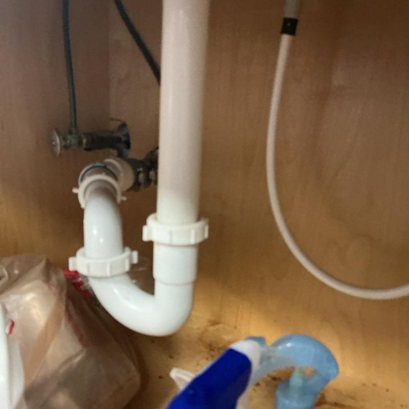 PVC sink drain pipe under cabinet with new fittings PVC sink drain pipe under cabinet with new fittings
