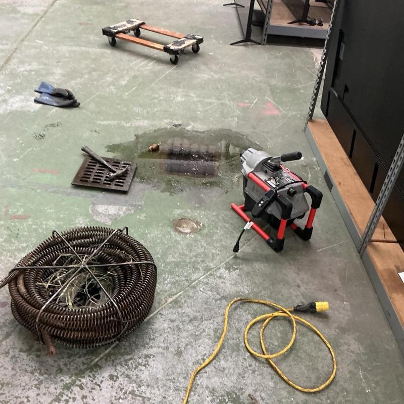 Cast iron drain with cleaning machine and cables Cast iron drain with cleaning machine and cables