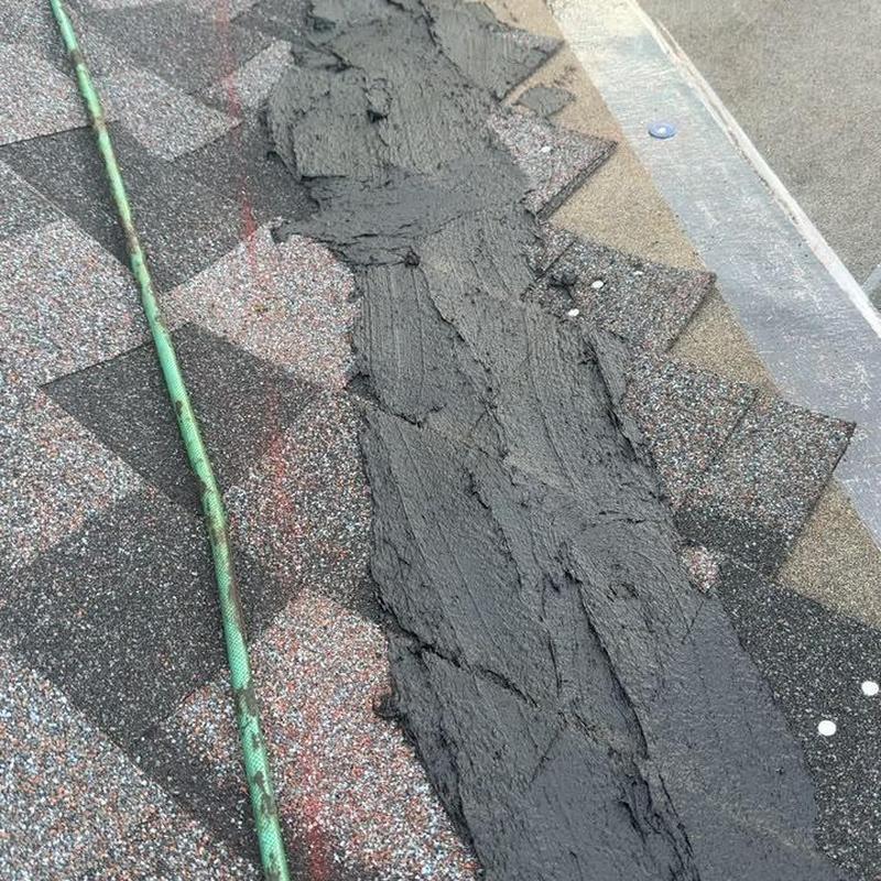 Roof ridge with black roofing cement applied Roof ridge with black roofing cement applied