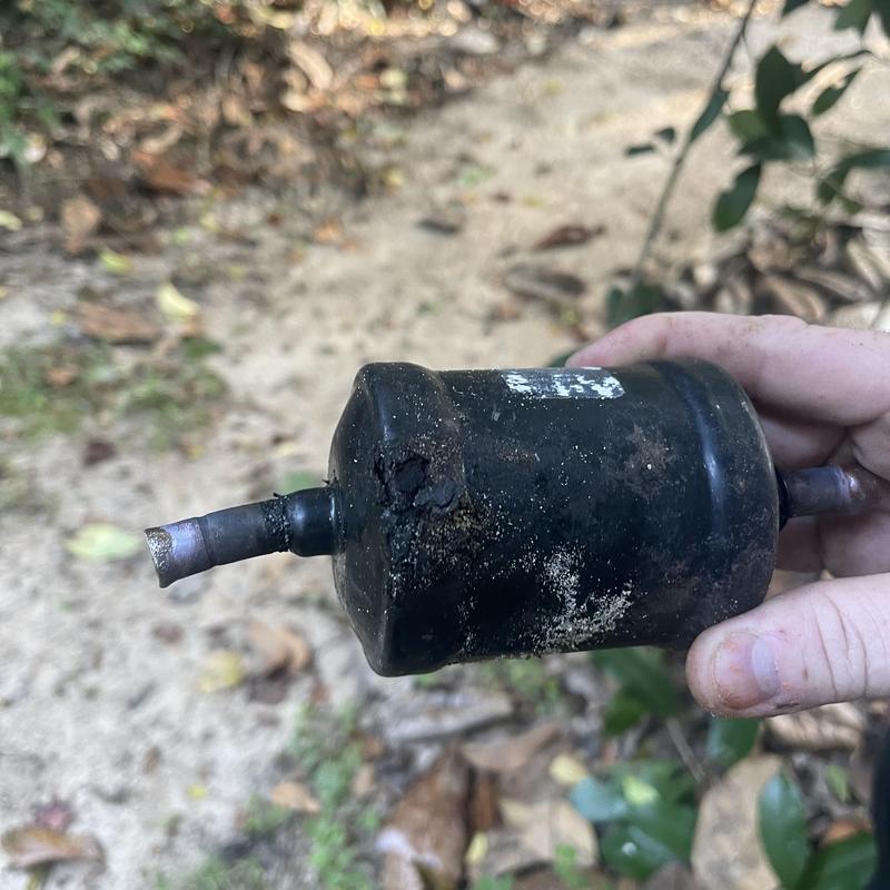 Filter dryer with visible leak damage and corrosion