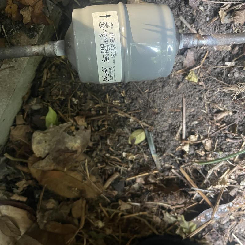 Filter dryer on refrigerant line outdoors dirt
